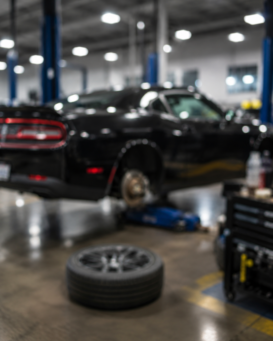 Vehicle undergoing repair on a jack
